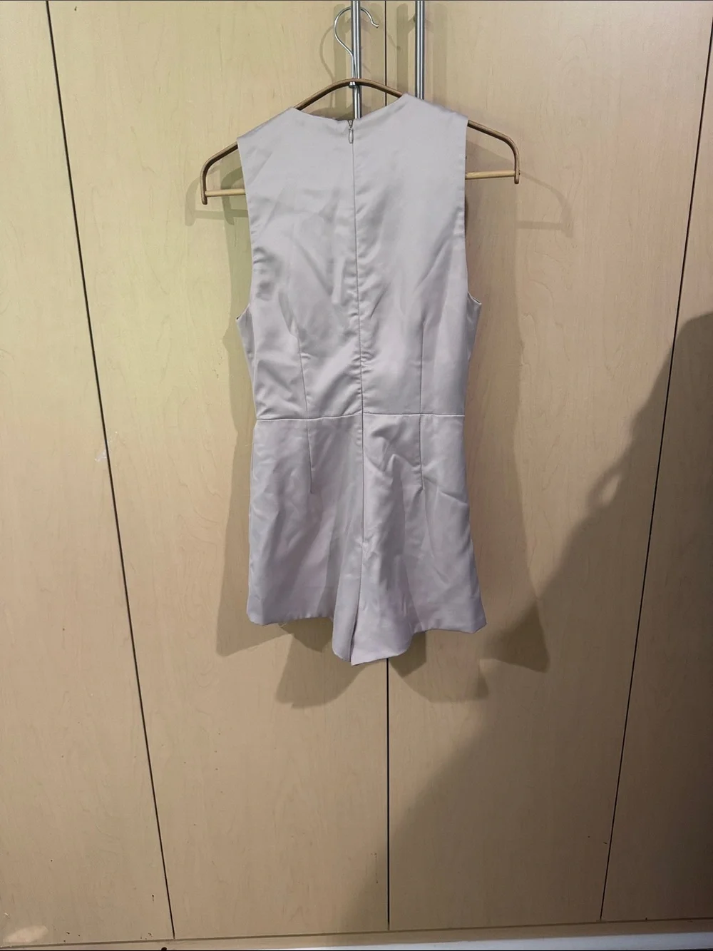 DO+BE Sleeveless elegant Draped Satin V-Neck Romper in golden cream.